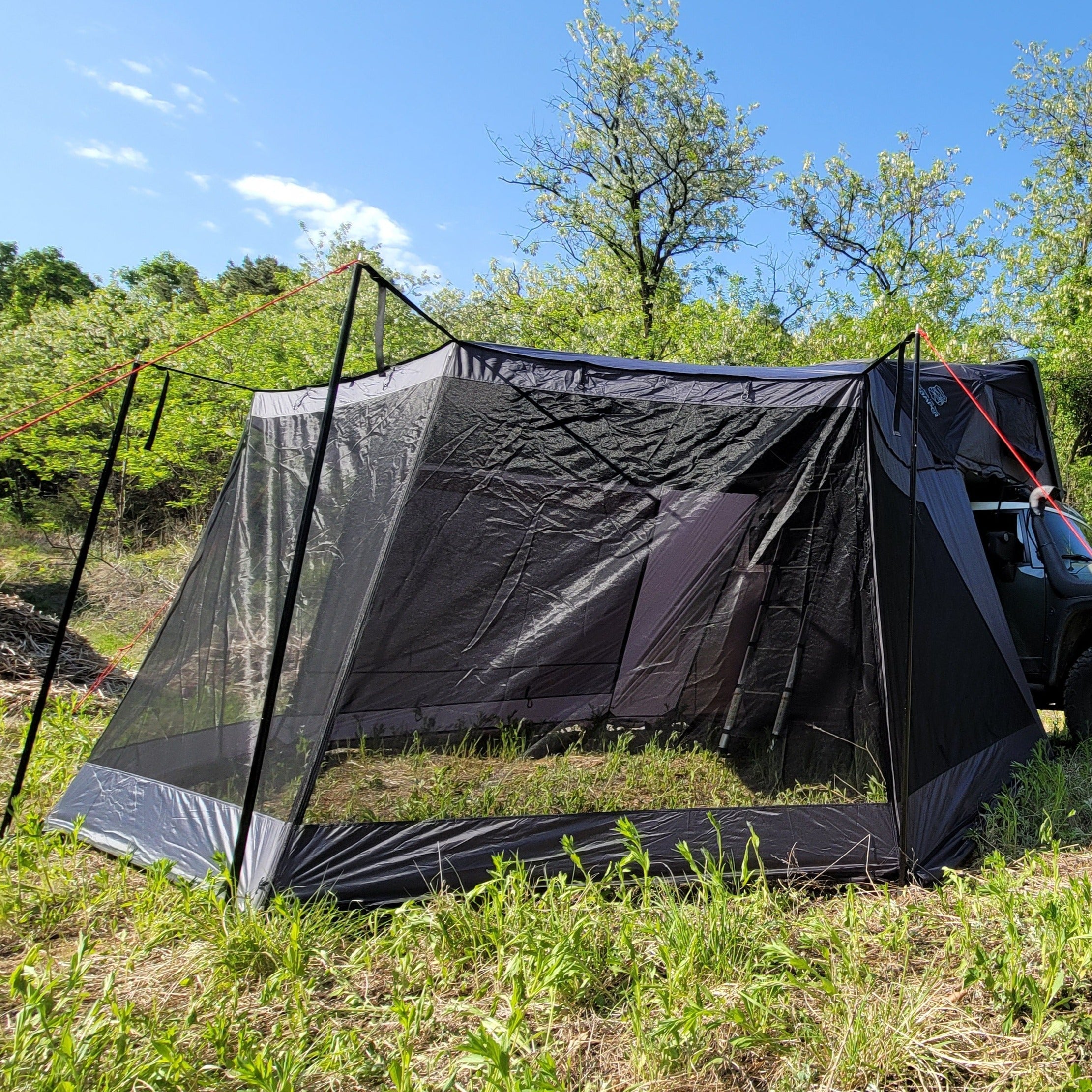 LNT Overland's Skycamp Awning Mesh Screen is installed with ikamper Skycamp and closed.